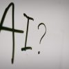 a sign with a question mark and a question mark drawn on it